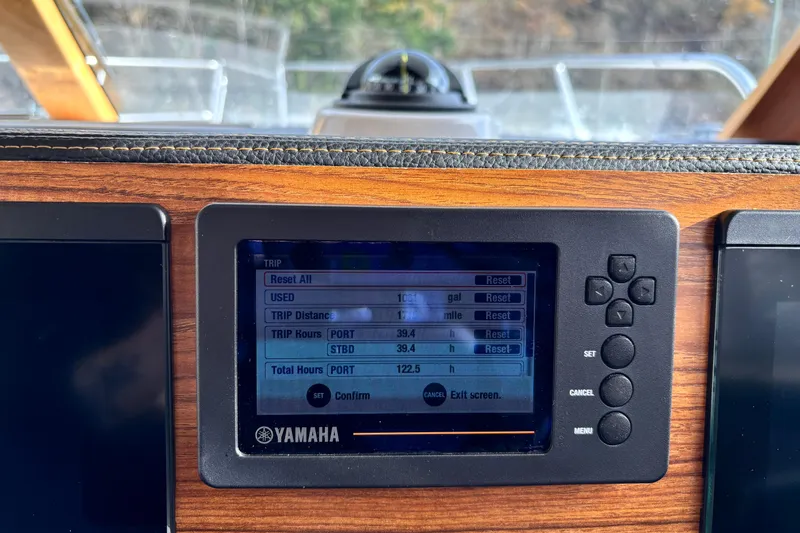  Yacht Photos Pics Yamaha display on 2023 Cutwater C-32 Coupe showing trip data and settings.
