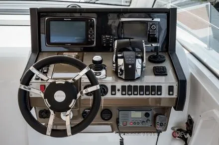 Lux Life Yacht Photos Pics Manufacturer Provided Image: 2017 Cruisers Yachts 39 Express Coupe helm with steering wheel, navigation, and control systems.