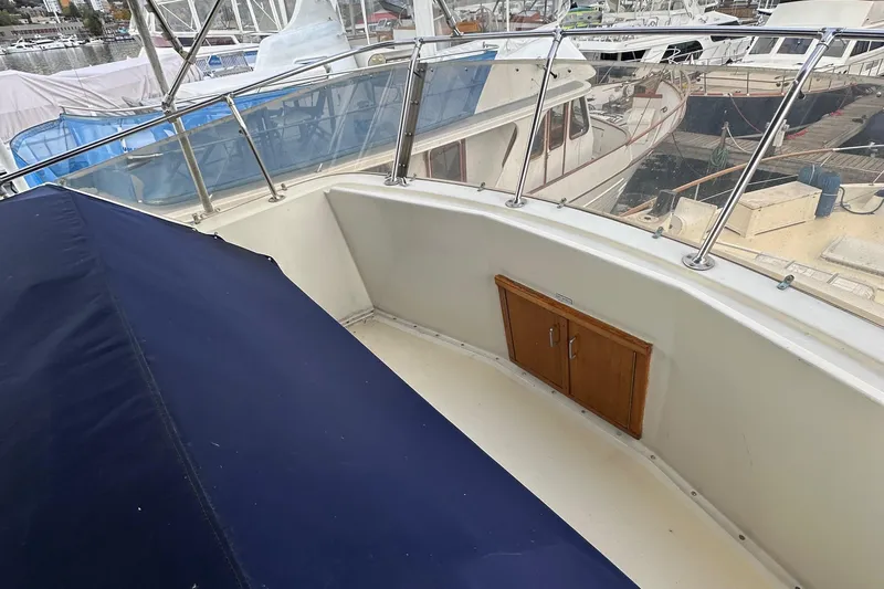 Double Play Yacht Photos Pics 1980 Hatteras 58 Yachtfish deck with railing and storage compartment.