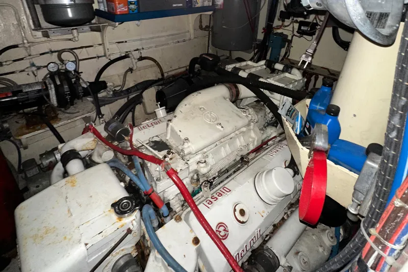 Double Play Yacht Photos Pics Engine room of 1980 Hatteras 58 Yachtfish with diesel engine components.