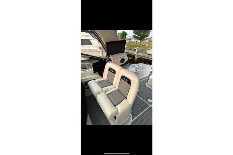  Yacht Photos Pics 2008 Sea Ray 350 Sundancer boat interior with cushioned seating and helm area.