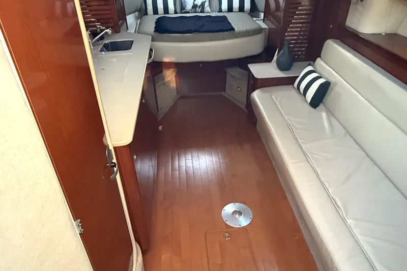  Yacht Photos Pics Interior of 2008 Sea Ray 350 Sundancer yacht with wood flooring and cozy seating.