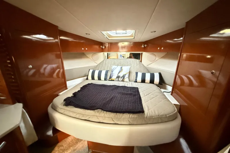  Yacht Photos Pics Luxurious cabin interior of 2008 Sea Ray 350 Sundancer yacht with cozy bedding.