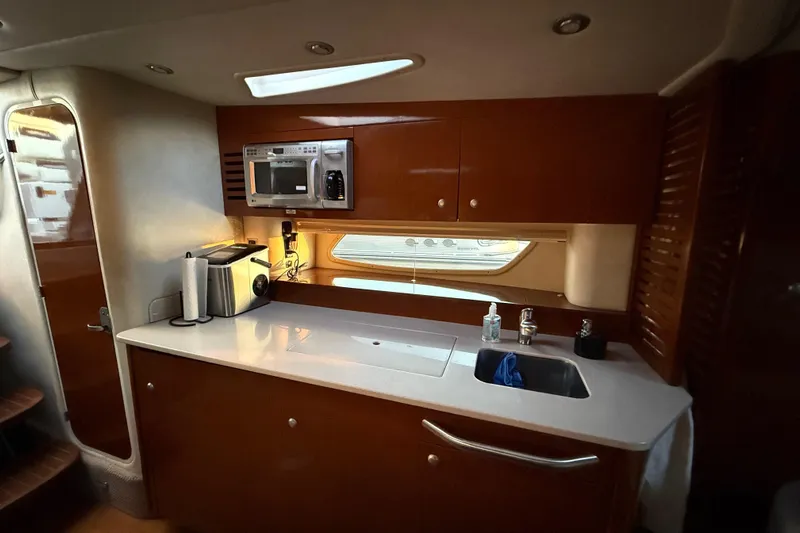  Yacht Photos Pics Luxurious 2008 Sea Ray 350 Sundancer yacht kitchen with modern amenities and sleek design.