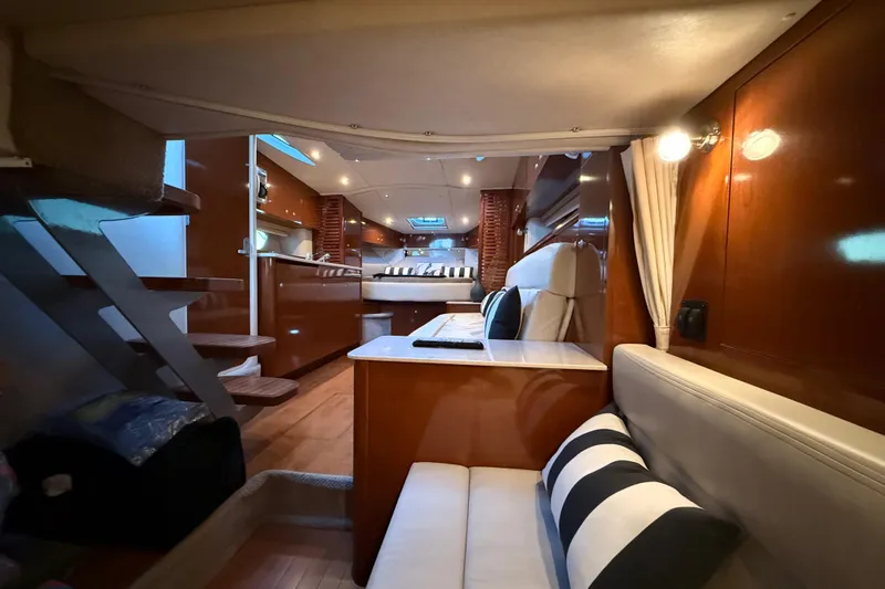  Yacht Photos Pics Luxurious interior of 2008 Sea Ray 350 Sundancer yacht with elegant wood finishes.