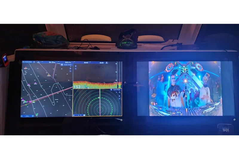 Wanderlust Yacht Photos Pics 2024 Costa Custom Boats 34 SV dashboard with navigation and entertainment screens.