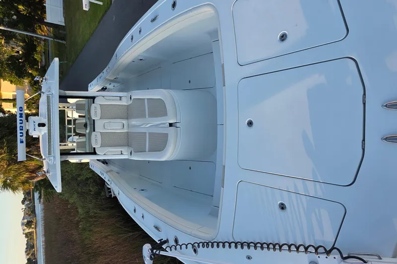 Wanderlust Yacht Photos Pics 2024 Costa Custom Boats 34 SV, sleek white deck with dual seating and advanced navigation.