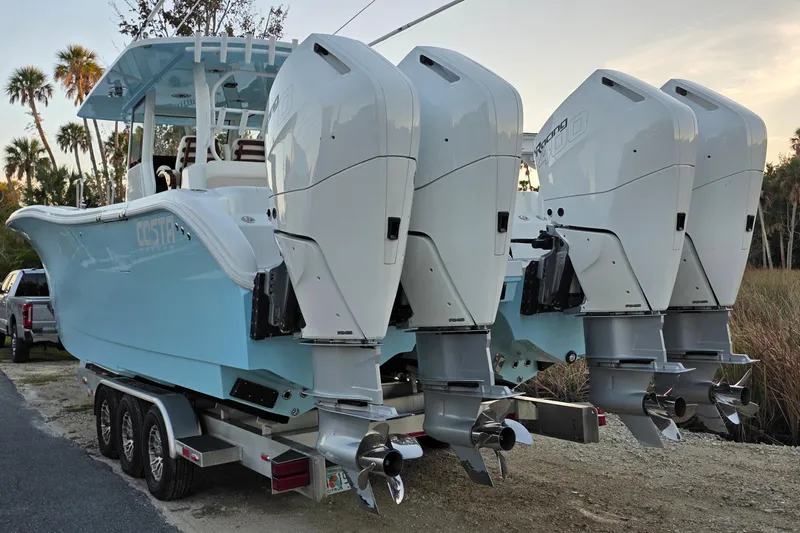 Wanderlust Yacht Photos Pics 2024 Costa Custom Boats 34 SV with quad engines on a trailer.