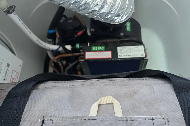 Wanderlust Yacht Photos Pics 2024 Costa Custom Boats 34 SV engine compartment with visible wiring and components.