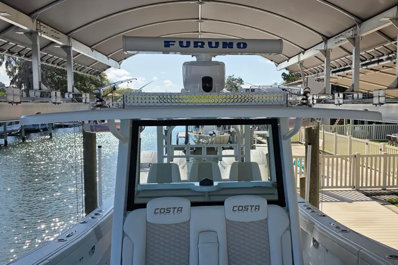 Wanderlust Yacht Photos Pics 2024 Costa Custom Boats 34 SV interior with Furuno radar, docked by the water.