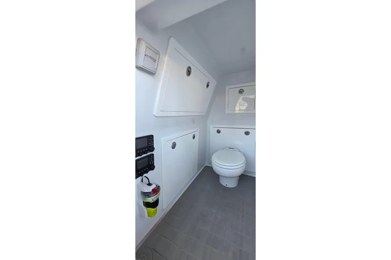 Wanderlust Yacht Photos Pics 2024 Costa Custom Boats 34 SV interior bathroom with modern fixtures and storage.