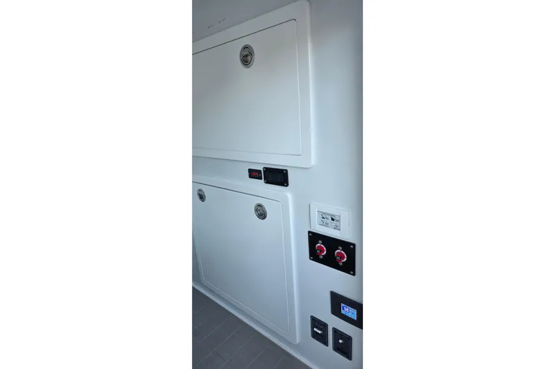 Wanderlust Yacht Photos Pics 2024 Costa Custom Boats 34 SV interior panel with controls and storage compartments.