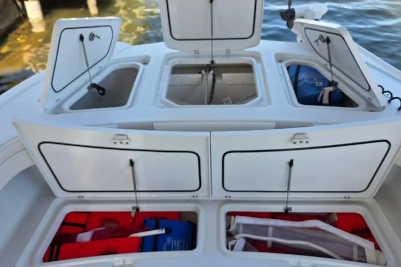 Wanderlust Yacht Photos Pics 2024 Costa Custom Boats 34 SV storage compartments with life jackets and equipment.