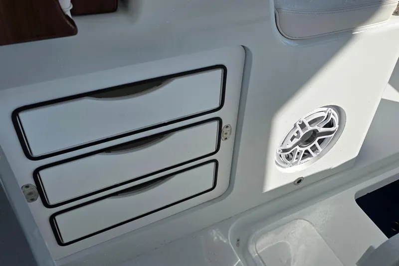 Wanderlust Yacht Photos Pics 2024 Costa Custom Boats 34 SV interior with storage drawers and speaker detail.