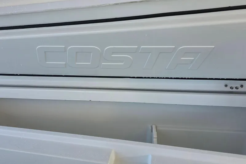 Wanderlust Yacht Photos Pics 2024 Costa Custom Boats 34 SV, embossed logo detail on white surface.