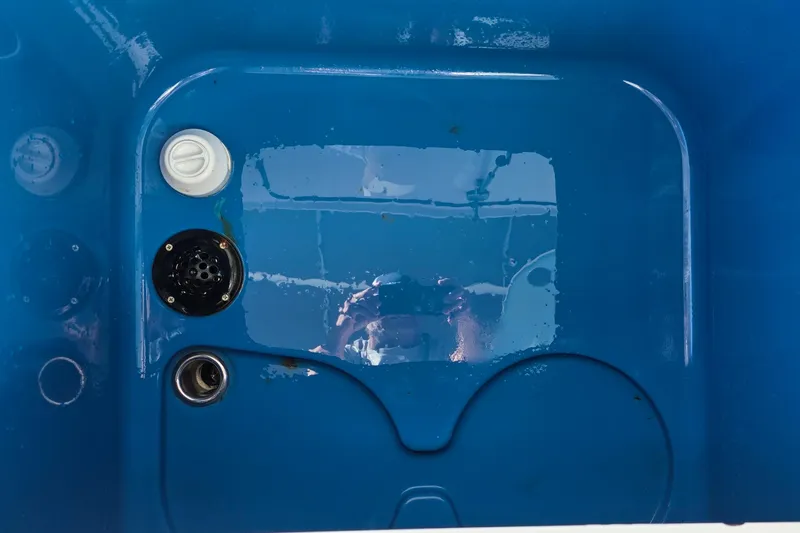 Wanderlust Yacht Photos Pics Blue interior of 2024 Costa Custom Boats 34 SV, featuring drainage and control elements.