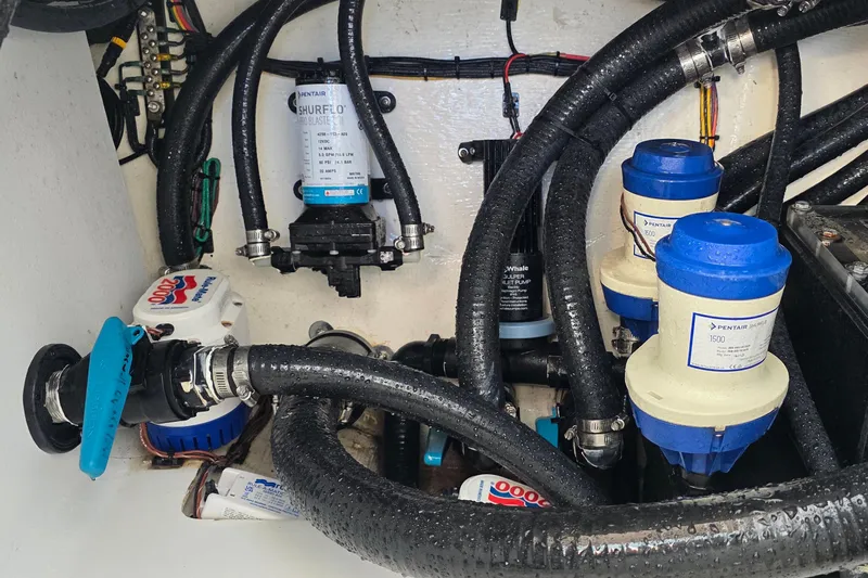 Wanderlust Yacht Photos Pics 2024 Costa Custom Boats 34 SV engine compartment with pumps and hoses.