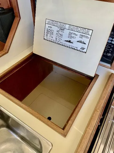  Yacht Photos Pics Open storage compartment in 1999 Island Packet 380 yacht galley.