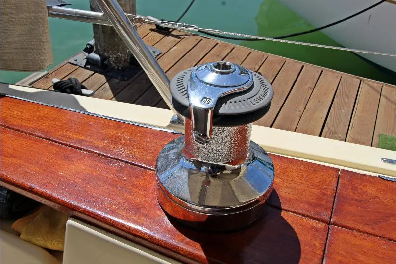  Yacht Photos Pics Winch on 1999 Island Packet 380 sailboat, docked with polished wood deck.