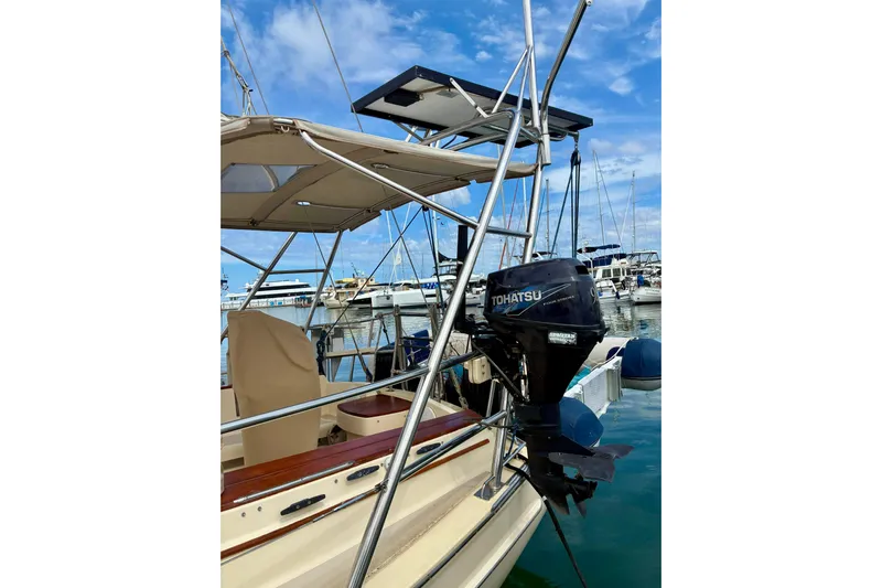  Yacht Photos Pics Island Packet 380 sailboat with Tohatsu outboard motor, docked in a marina, 1999 model.