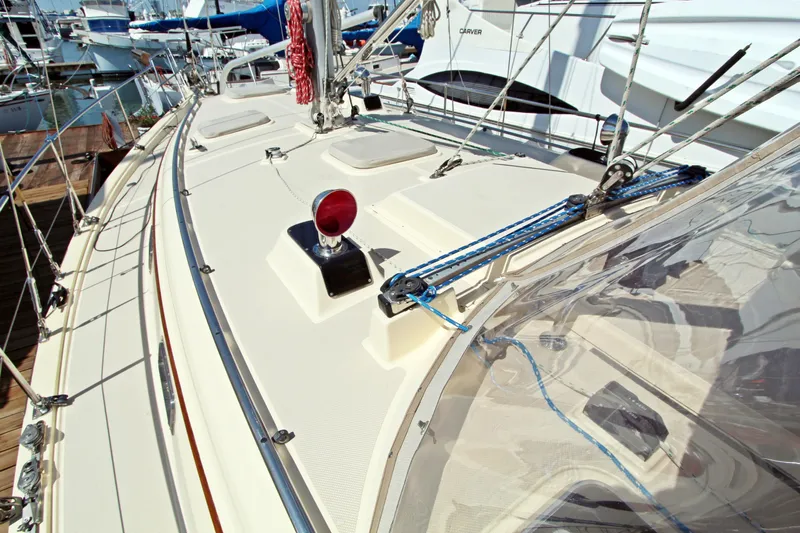  Yacht Photos Pics Deck view of 1999 Island Packet 380 sailboat, showcasing rigging and fittings at marina.
