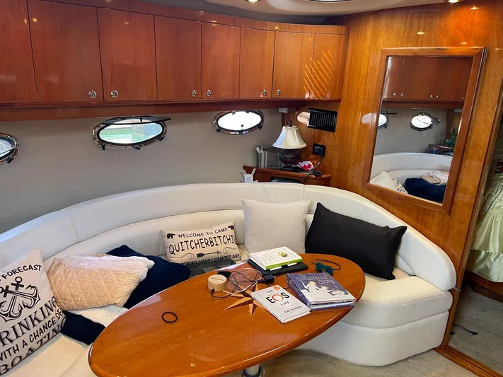  Yacht Photos Pics Luxurious 2005 Regal Commodore 4260 yacht interior with elegant seating and wooden accents.