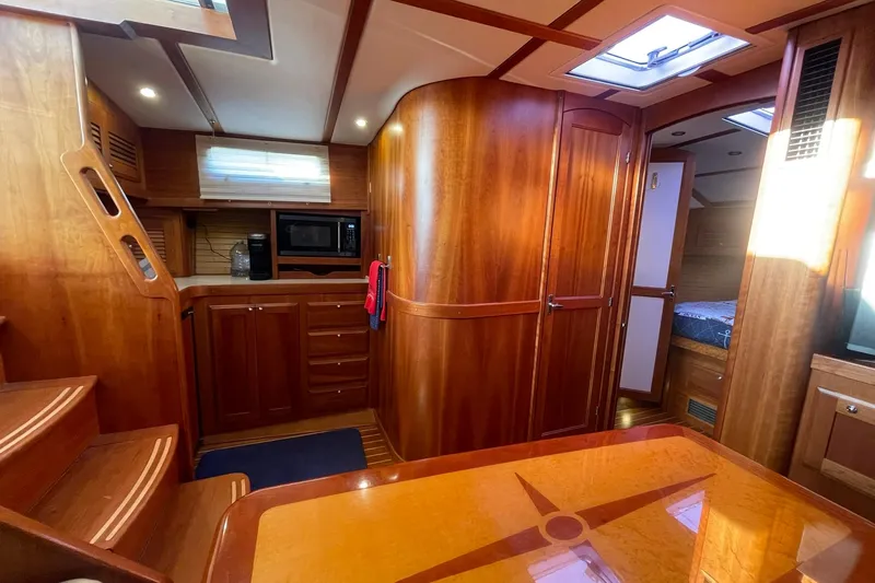 Ocean Breeze Yacht Photos Pics Interior of 2008 Sabre 38 Salon Express yacht with wooden cabinetry and modern amenities.