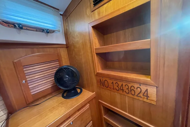 Ocean Breeze Yacht Photos Pics Interior of 2008 Sabre 38 Salon Express with wooden cabinetry and fan.