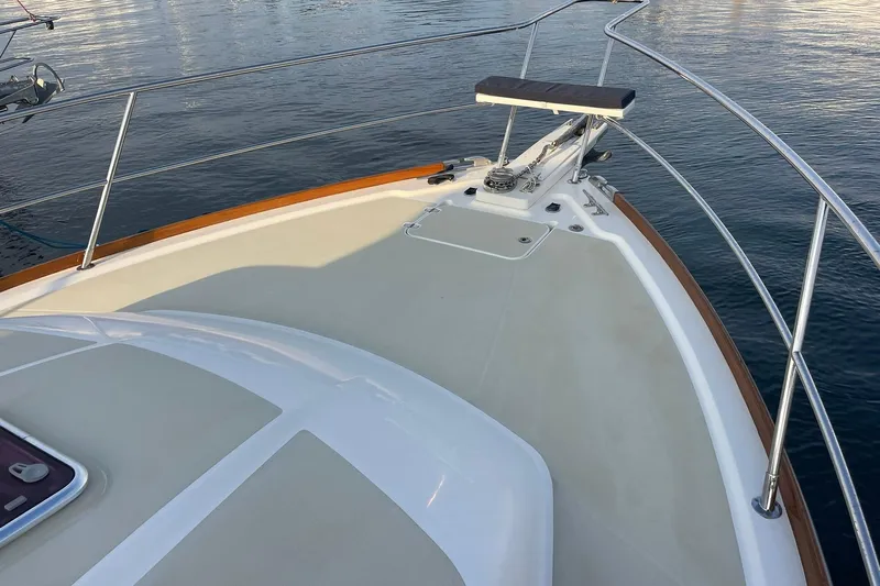 Ocean Breeze Yacht Photos Pics 2008 Sabre 38 Salon Express yacht bow with stainless steel railings on calm water.