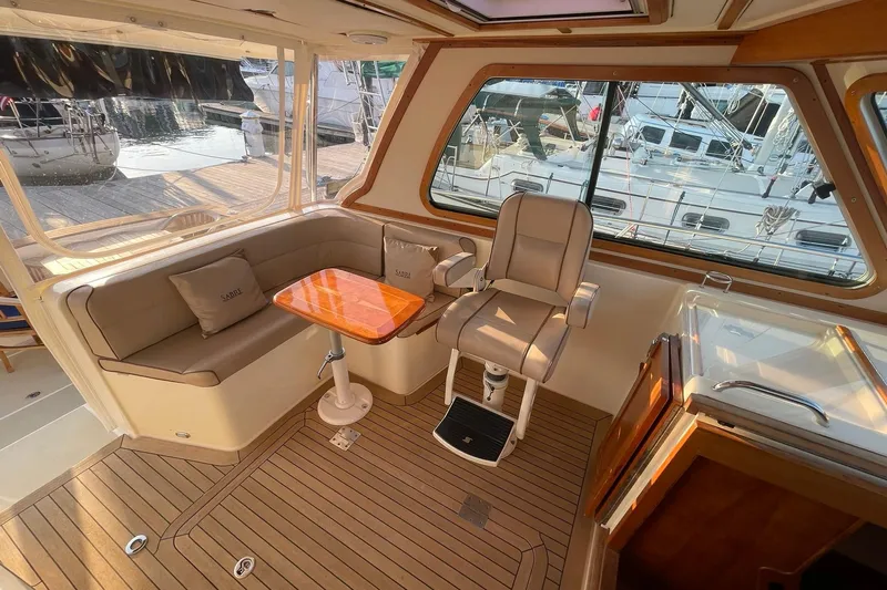 Ocean Breeze Yacht Photos Pics Luxurious interior of 2008 Sabre 38 Salon Express yacht with seating and helm.