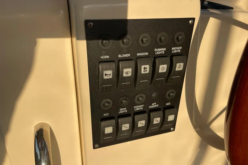 Ocean Breeze Yacht Photos Pics Control panel on a 2008 Sabre 38 Salon Express yacht, featuring various switches.