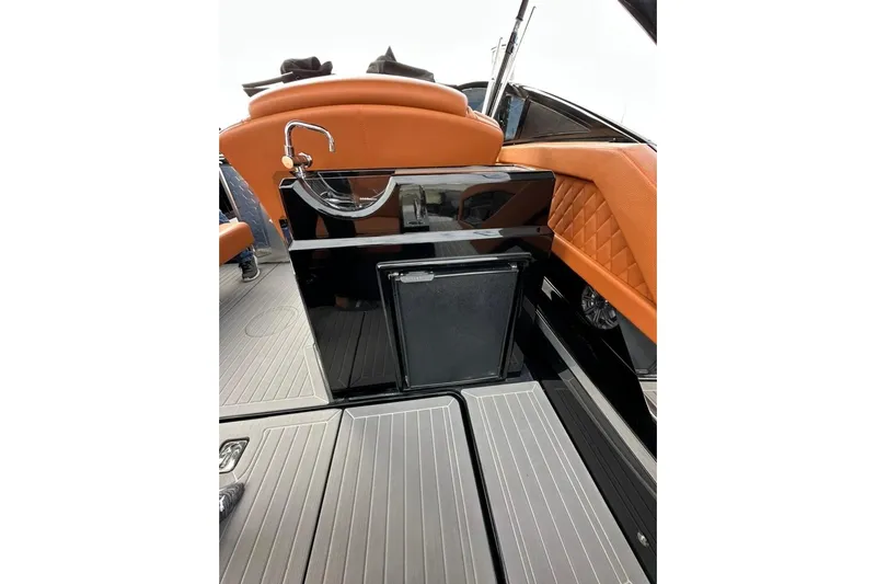  Yacht Photos Pics 2021 Cruisers Yachts 338 South Beach Edition Bow Rider interior with sleek design and orange accents.