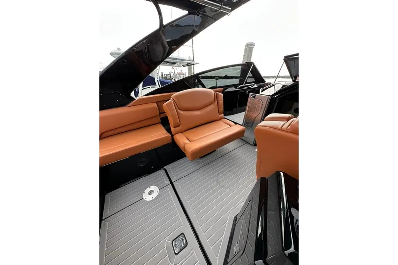  Yacht Photos Pics 2021 Cruisers Yachts 338 South Beach Edition Bow Rider interior with tan leather seating.