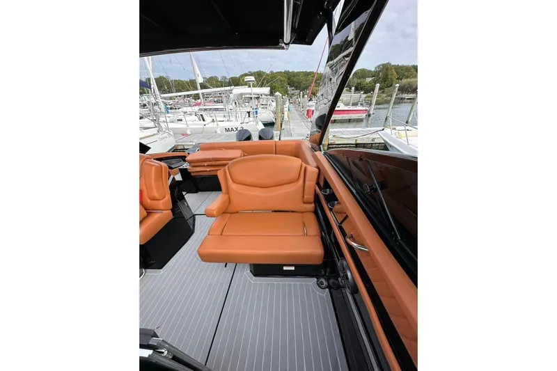  Yacht Photos Pics 2021 Cruisers Yachts 338 South Beach Edition Bow Rider interior with tan leather seating.
