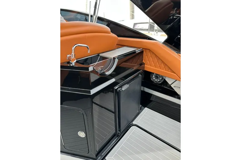  Yacht Photos Pics 2021 Cruisers Yachts 338 South Beach Edition Bow Rider interior with sleek sink and cabinetry.