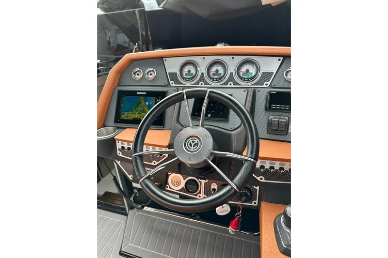  Yacht Photos Pics 2021 Cruisers Yachts 338 South Beach Edition Bow Rider dashboard with steering wheel and controls.