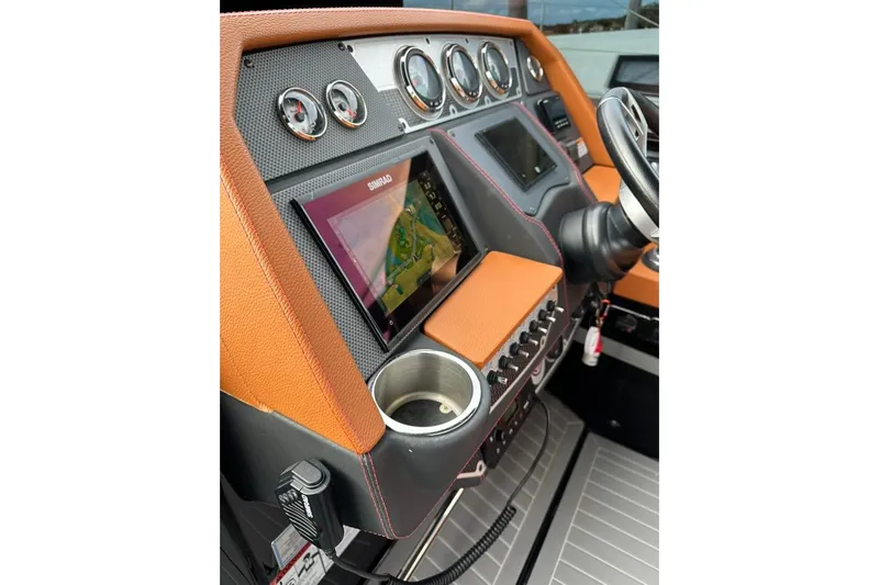  Yacht Photos Pics 2021 Cruisers Yachts 338 South Beach Edition Bow Rider dashboard with navigation system and controls.
