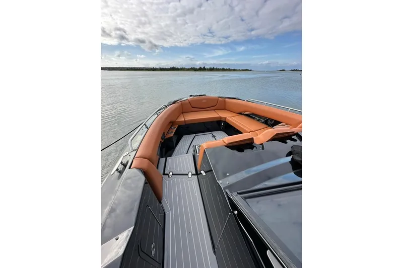  Yacht Photos Pics 2021 Cruisers Yachts 338 South Beach Edition Bow Rider on serene water.