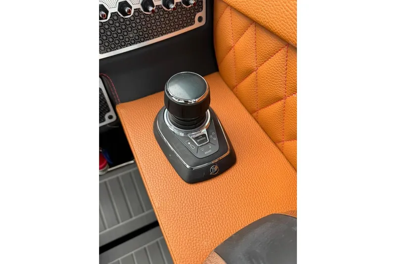  Yacht Photos Pics Joystick control on 2021 Cruisers Yachts 338 South Beach Edition Bow Rider, orange leather detail.