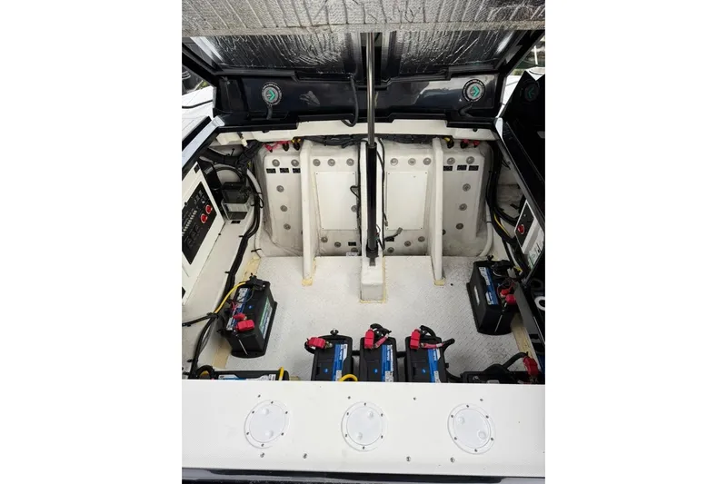  Yacht Photos Pics Engine compartment of 2021 Cruisers Yachts 338 South Beach Edition Bow Rider with visible batteries.