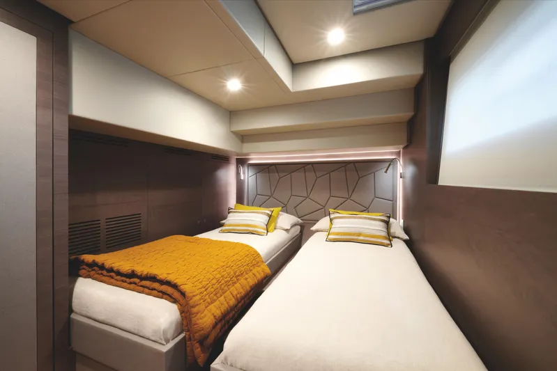  Yacht Photos Pics Luxurious twin bedroom in 2025 Silent 60 yacht, featuring modern design and cozy lighting.