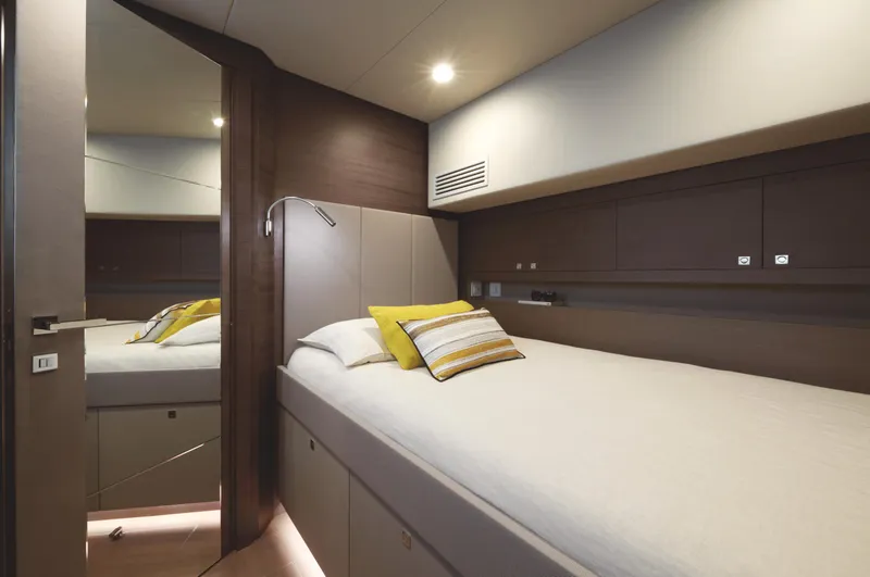  Yacht Photos Pics Luxurious cabin interior of 2025 Silent 60 yacht with modern bedding and ambient lighting.