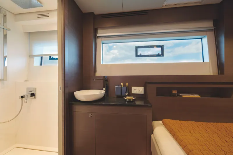  Yacht Photos Pics Luxurious interior of 2025 Silent 60 yacht with modern bathroom and cozy bedroom.