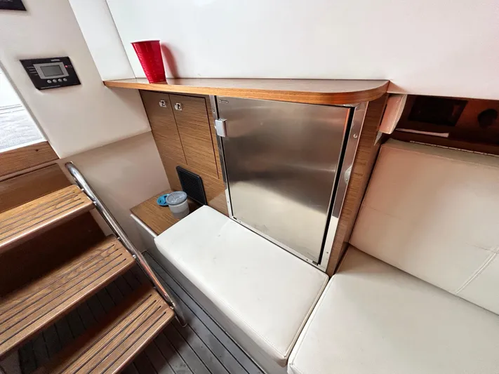 Swallow Yacht Photos Pics Interior of 2017 Cruisers Yachts 338 Sport Series with seating and mini fridge.