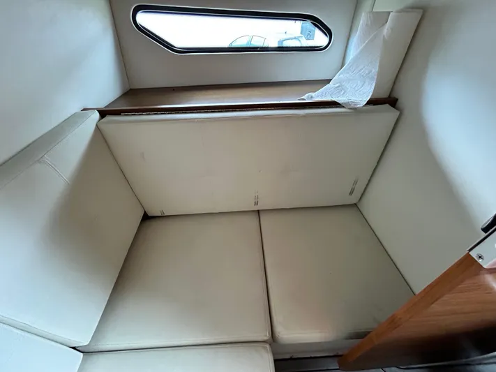 Swallow Yacht Photos Pics Interior cabin of 2017 Cruisers Yachts 338 Sport Series with cushioned seating.