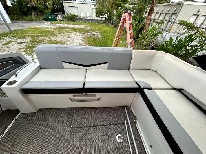 Swallow Yacht Photos Pics 2017 Cruisers Yachts 338 Sport Series interior seating area with gray and white upholstery.