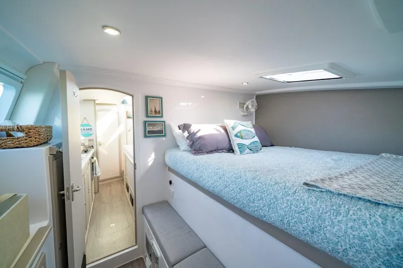 Sugarloaf Yacht Photos Pics 2023 Seawind 1160 Lite interior cabin with cozy bed and modern decor.