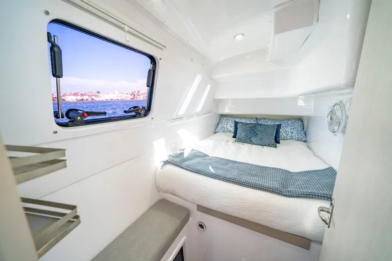Sugarloaf Yacht Photos Pics Cozy cabin interior of 2023 Seawind 1160 Lite catamaran with ocean view window.