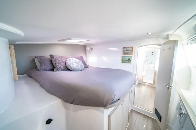 Sugarloaf Yacht Photos Pics Cozy bedroom in 2023 Seawind 1160 Lite catamaran with modern decor and natural light.