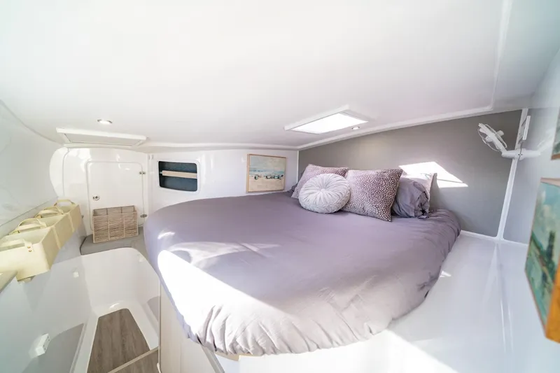 Sugarloaf Yacht Photos Pics Cozy bedroom in 2023 Seawind 1160 Lite catamaran with skylight and modern decor.